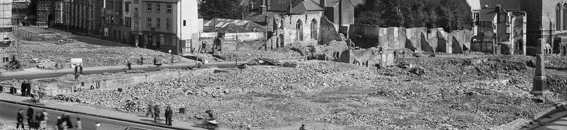 Cathedral in background with flattened streets and rubble in the foreground