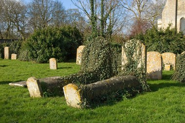 Tombs in churchyard, St Thomas a Becket Church, Ramsey, Cambridgeshire.