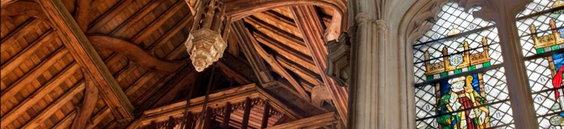 The ceiling and stained glass windows of the Great Hall at Eltham Palace.