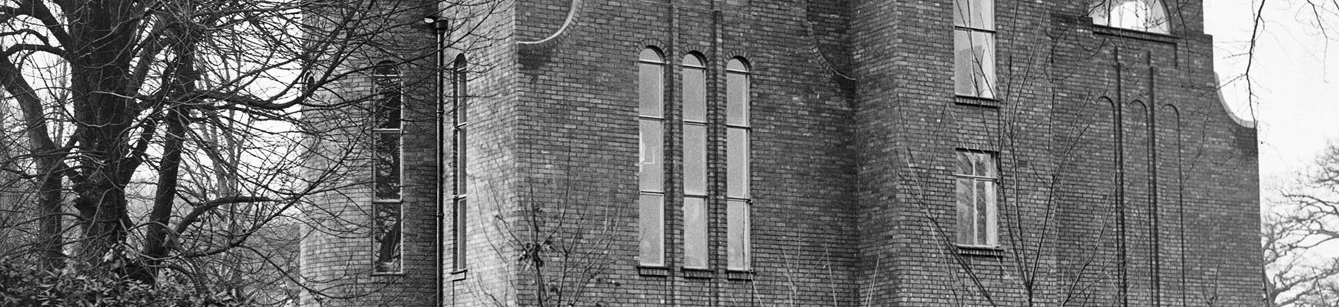 Two people standing on the roof of Dorich House