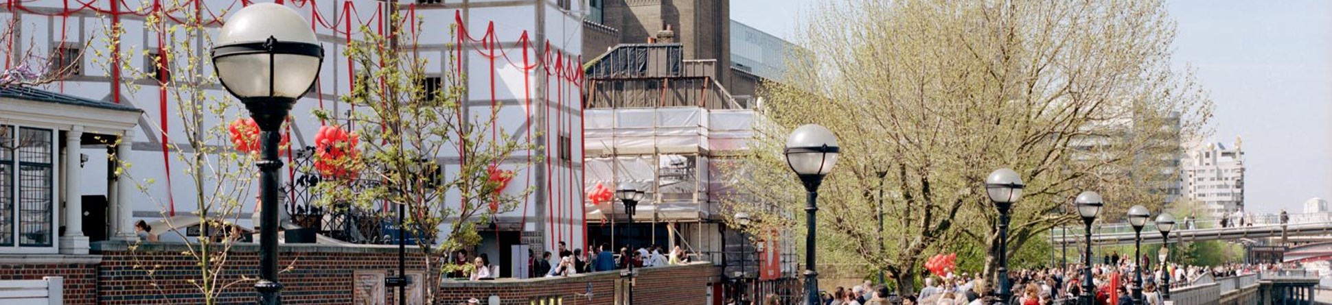 Crowds walking past Shakespeare's Globe, Southwark