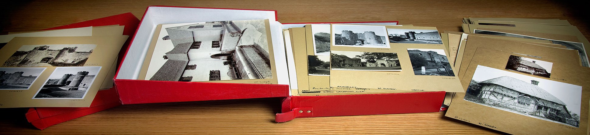 England's Places: An open red box with a series of cards displayed on a table