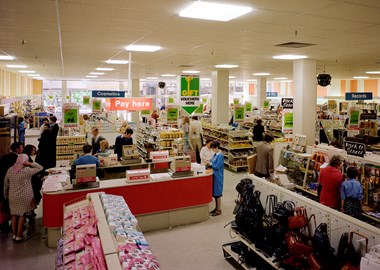 A bright red ‘cash and wrap’ desk in Store 59, Belfast, photograph taken in 1978