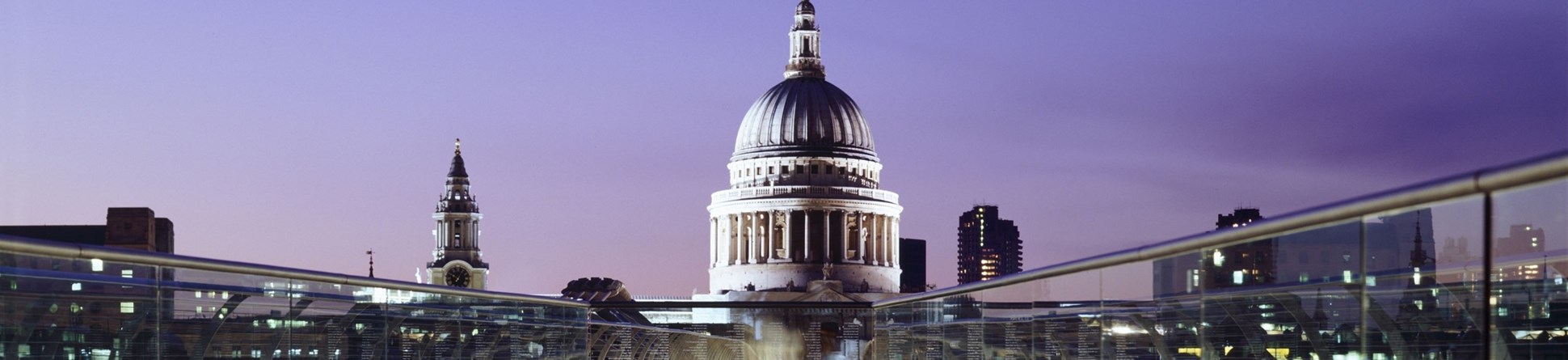 St Paul's cathedral at night, viewed across the London Millenium Footbridge.