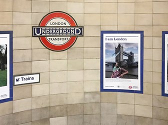 Three portraits from Historic England's I am London series displayed at Algate East Underground Station