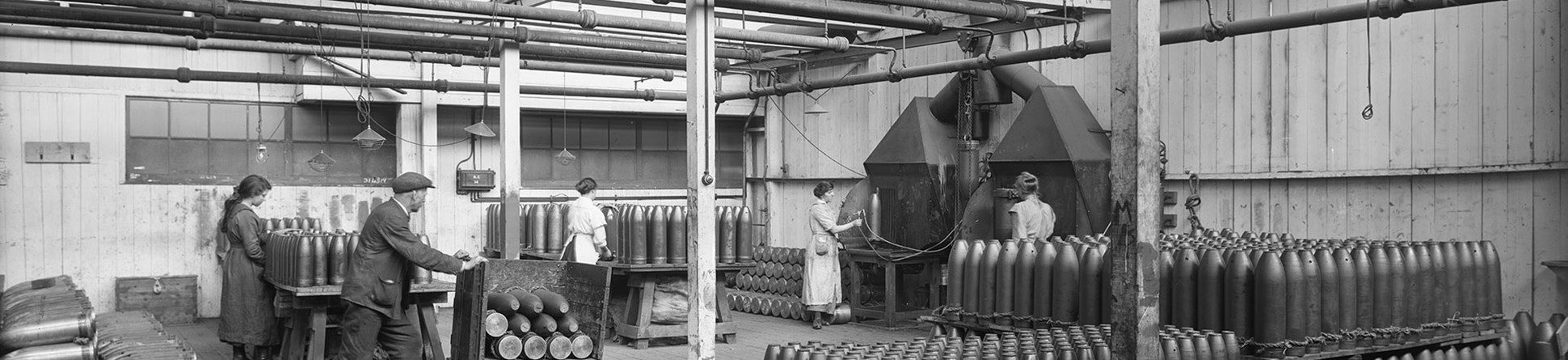 Cunards Shellworks, Liverpool, a man stacks finished shells in a loading bay ready for collection by a lorry.