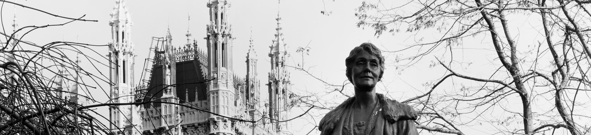 Statue of Emmeline Pankhurst with the spires of Westminster in the background