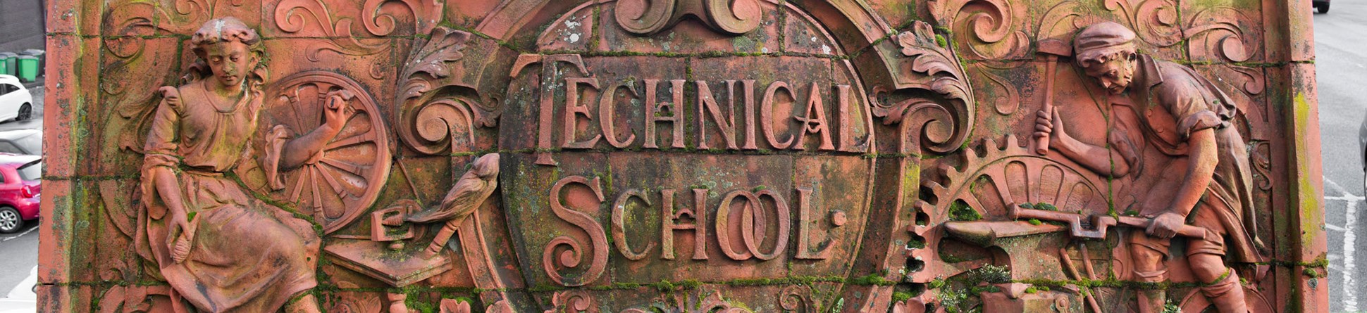 A freestanding panel with two figures and the words 'Technical School'.