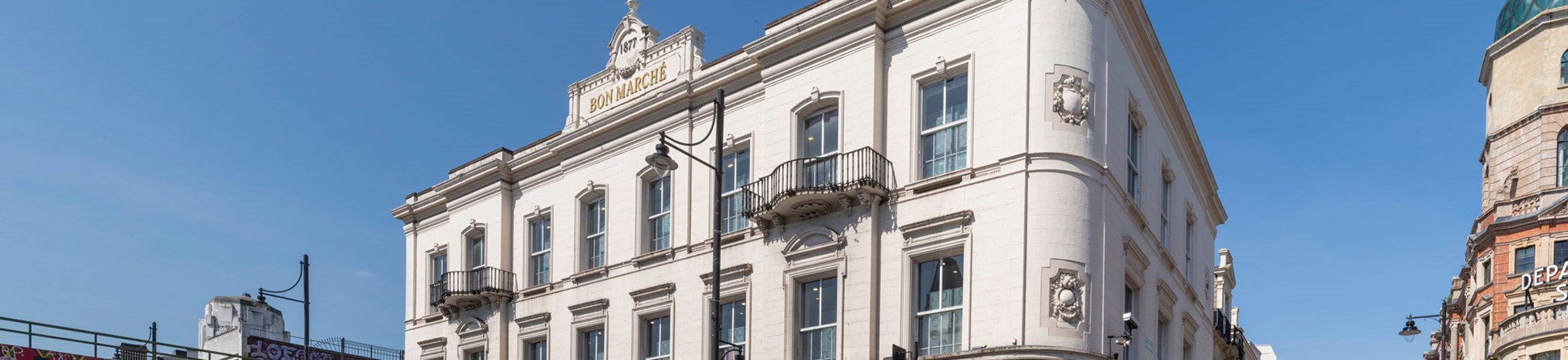 A three-storey Victorian department store with modern shopfronts to the ground floor.