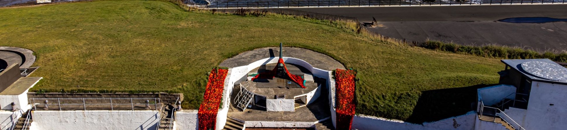 Aerial view of a coastal artillery battery next to the sea.